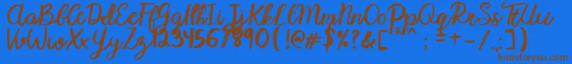 Karmany Regular Font – Brown Fonts on Blue Background