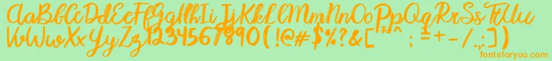Karmany Regular Font – Orange Fonts on Green Background