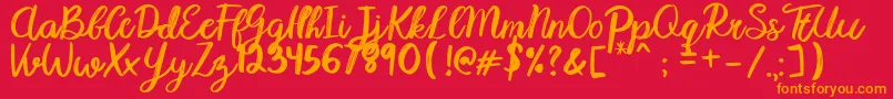Karmany Regular Font – Orange Fonts on Red Background