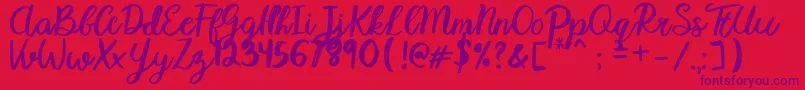 Karmany Regular Font – Purple Fonts on Red Background