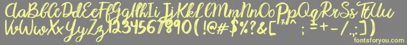 Karmany Regular Font – Yellow Fonts on Gray Background