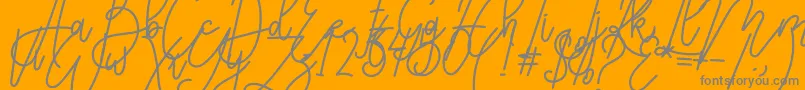 Karyland-Schriftart – Graue Schriften auf orangefarbenem Hintergrund