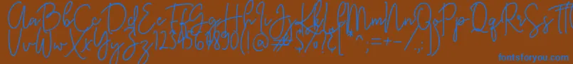 KastingScript Font – Blue Fonts on Brown Background