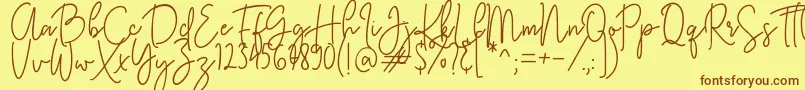 KastingScript Font – Brown Fonts on Yellow Background
