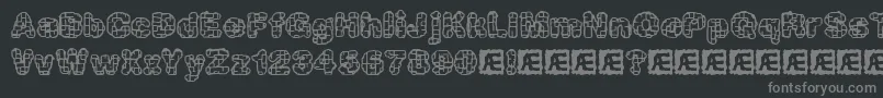 kataacti-fontti – harmaat kirjasimet mustalla taustalla