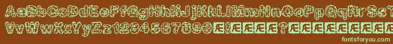 フォントkataacti – 緑色の文字が茶色の背景にあります。