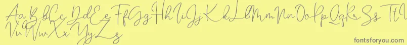 Katalia-Schriftart – Graue Schriften auf gelbem Hintergrund