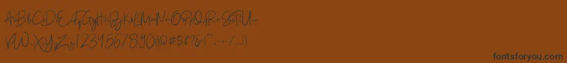 Kathlyn Font – Black Fonts on Brown Background