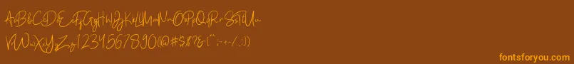 Kathlyn-fontti – oranssit fontit ruskealla taustalla