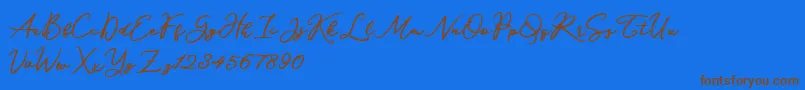 Katrine Holland-Schriftart – Braune Schriften auf blauem Hintergrund