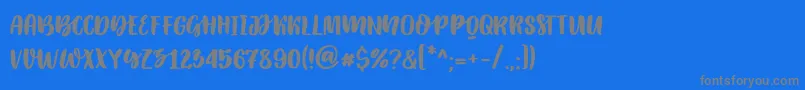 Katsia Jazwinska   Elowen Caps Font – Gray Fonts on Blue Background