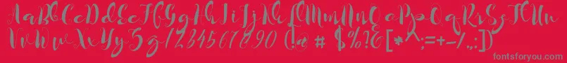 kayla-Schriftart – Graue Schriften auf rotem Hintergrund