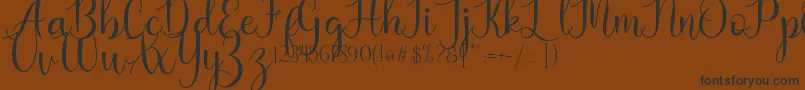 Kaylia Font – Black Fonts on Brown Background