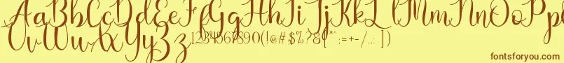 Kaylia Font – Brown Fonts on Yellow Background