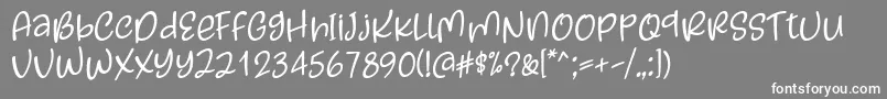 フォントKayskew October Eleven Font by Situjuh 7NTypes – 灰色の背景に白い文字