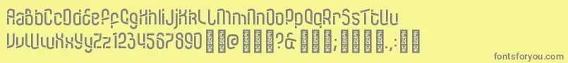 フォントKDTramcar Regular – 黄色の背景に灰色の文字