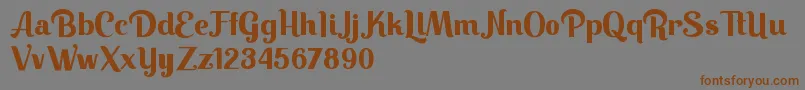 フォントKeilla – 茶色の文字が灰色の背景にあります。