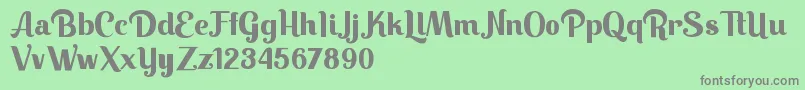 Keilla-fontti – harmaat kirjasimet vihreällä taustalla