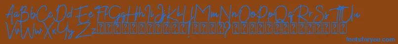 Kekasih Font DEMO-Schriftart – Blaue Schriften auf braunem Hintergrund
