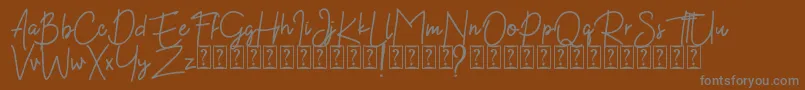 Kekasih Font DEMO Font – Gray Fonts on Brown Background