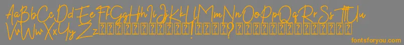 Kekasih Font DEMO-Schriftart – Orangefarbene Schriften auf grauem Hintergrund