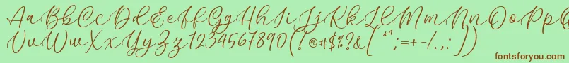 Kelidya Font by Keithzo 7NTypes Font – Brown Fonts on Green Background