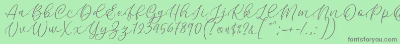 Kelidya Font by Keithzo 7NTypes Font – Gray Fonts on Green Background
