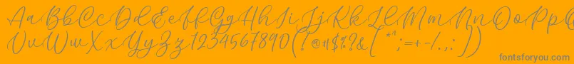 Fonte Kelidya Font by Keithzo 7NTypes – fontes cinzas em um fundo laranja