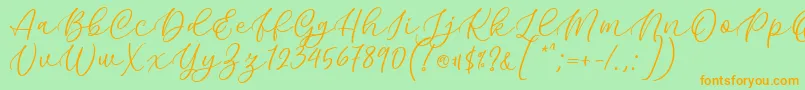 Kelidya Font by Keithzo 7NTypes Font – Orange Fonts on Green Background