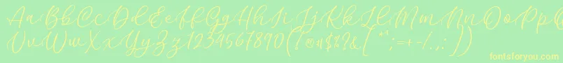 Kelidya Font by Keithzo 7NTypes Font – Yellow Fonts on Green Background