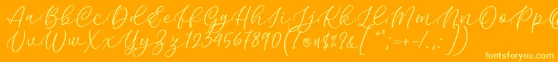 Kelidya Font by Keithzo 7NTypes Font – Yellow Fonts on Orange Background