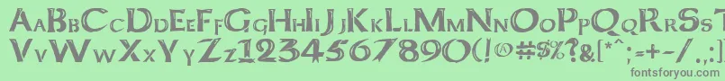 Шрифт Kelt Caps Freehand – серые шрифты на зелёном фоне