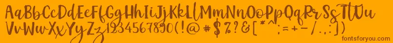 Kemistale Regular Font – Brown Fonts on Orange Background