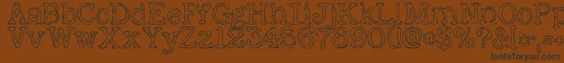 KGAlreadyHome-Schriftart – Schwarze Schriften auf braunem Hintergrund