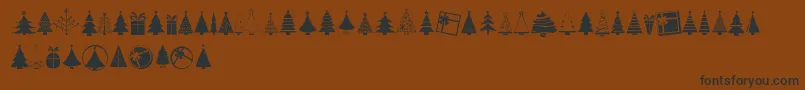 KGChristmasTrees-Schriftart – Schwarze Schriften auf braunem Hintergrund