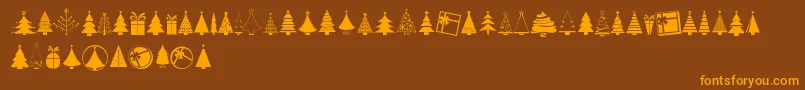 KGChristmasTrees-Schriftart – Orangefarbene Schriften auf braunem Hintergrund