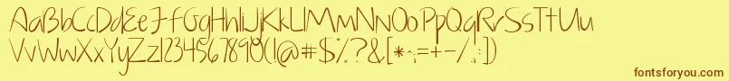 フォントKGJustGiveMeAReason – 茶色の文字が黄色の背景にあります。