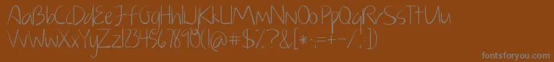 KGJustGiveMeAReason-fontti – harmaat kirjasimet ruskealla taustalla