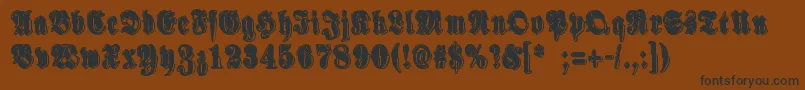 フォントSinisenharmaaPerkele – 黒い文字が茶色の背景にあります