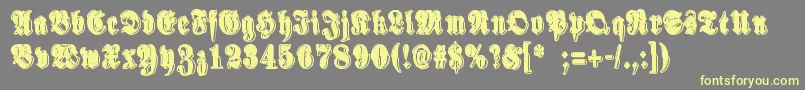 SinisenharmaaPerkele-Schriftart – Gelbe Schriften auf grauem Hintergrund