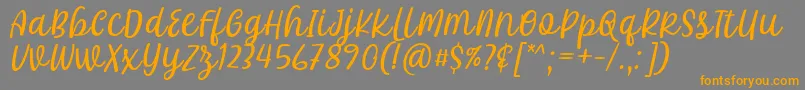 Khalifa Font by 7Ntypes D Font – Orange Fonts on Gray Background