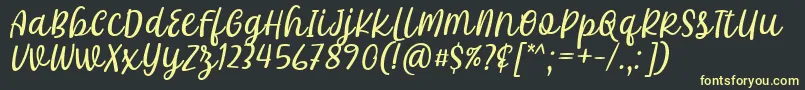 Czcionka Khalifa Font by 7Ntypes D – żółte czcionki na czarnym tle