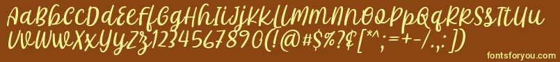 フォントKhalifa Font by 7Ntypes D – 黄色のフォント、茶色の背景