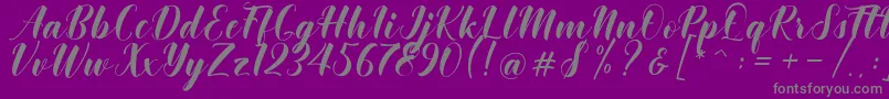 Fonte Khinta Script – fontes cinzas em um fundo violeta