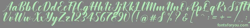Khinta Script Font – Green Fonts on Gray Background