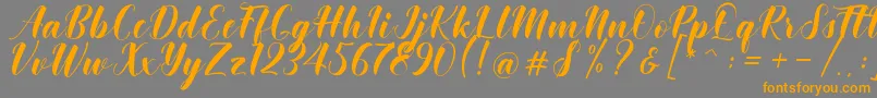 Khinta Script Font – Orange Fonts on Gray Background