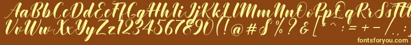 Khinta Script Font – Yellow Fonts on Brown Background