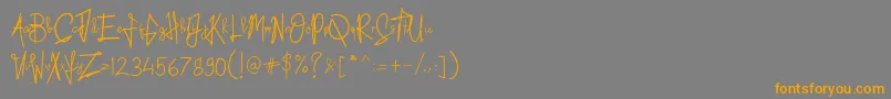 フォントKid Rough – オレンジの文字は灰色の背景にあります。