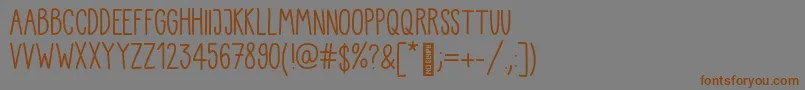 Kiddo Handwriting-Schriftart – Braune Schriften auf grauem Hintergrund
