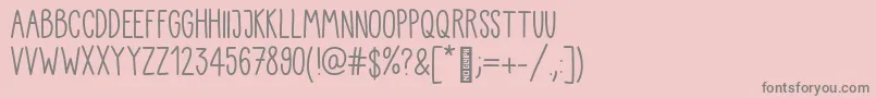 Fonte Kiddo Handwriting – fontes cinzas em um fundo rosa